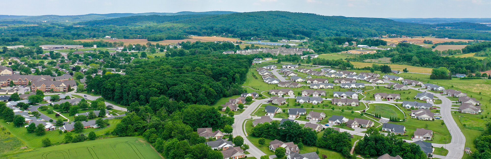 an aerial view of cross keys retirement village with a mountain in the background