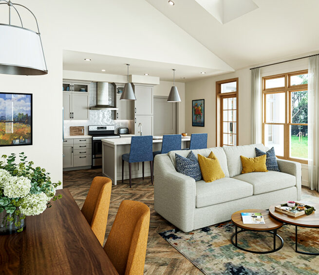 A neutral toned, open-concept living space with kitchen, dining area, and cozy living room.