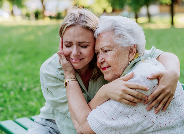 Worried,Senior,Grandmother,Comforting,Grown,Up,Granddaughter,When,Sitting,On