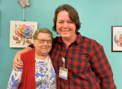 Two woman standing together smiling