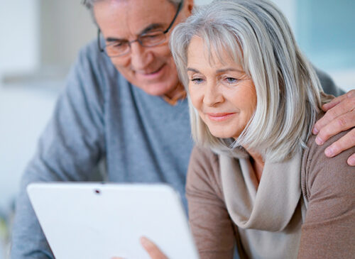 older couple using a tablet