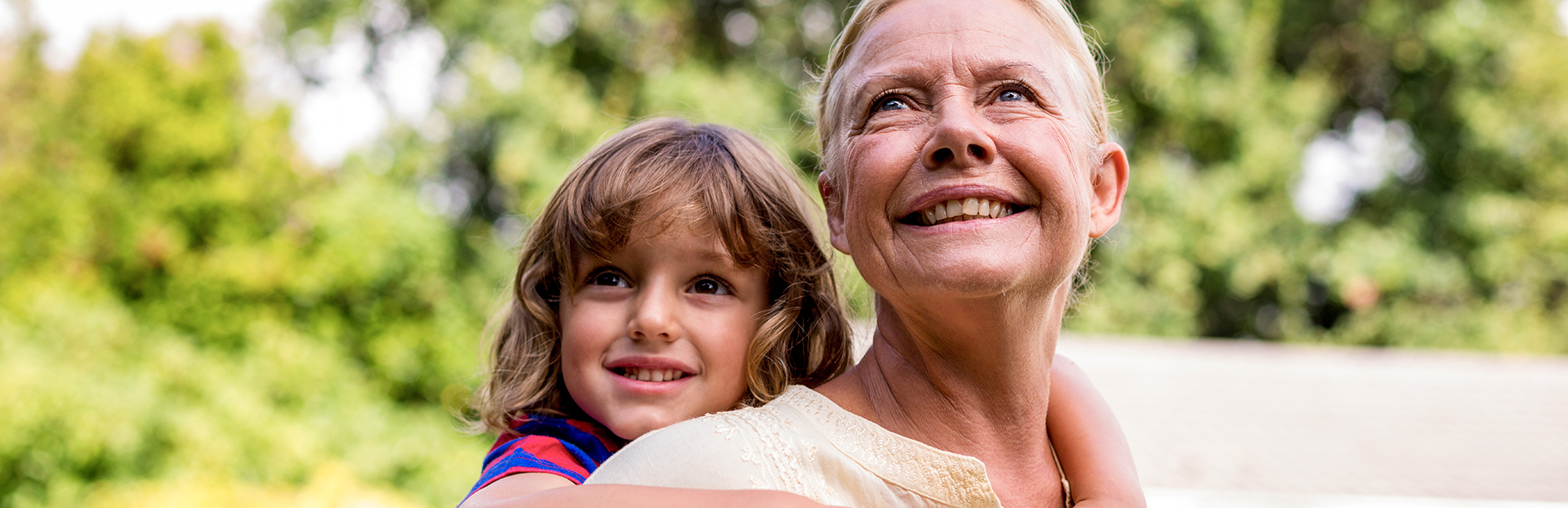 Grandmother carrying grandson