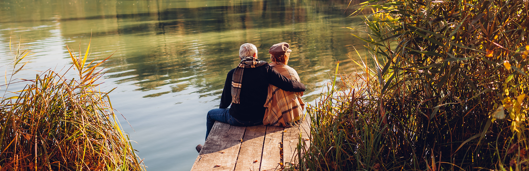 Senior,Family,Couple,Relaxing,By,Autumn,Lake.,Man,And,Woman