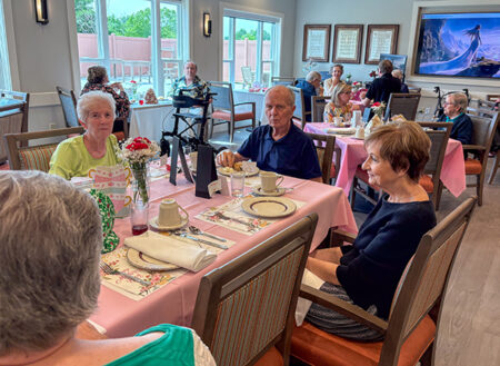 Cross Keys Village residents sitting around a table together