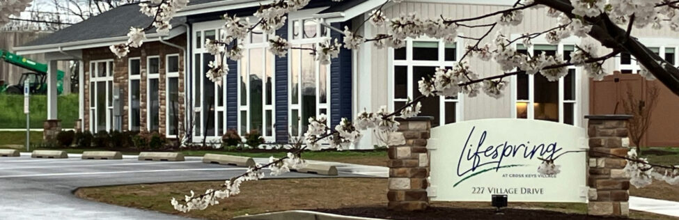 Lifespring at Cross Keys Village sign outside of a building
