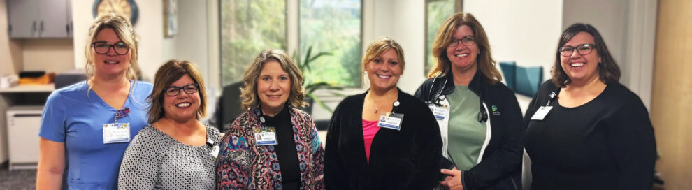 Village Health Services team standing together smiling